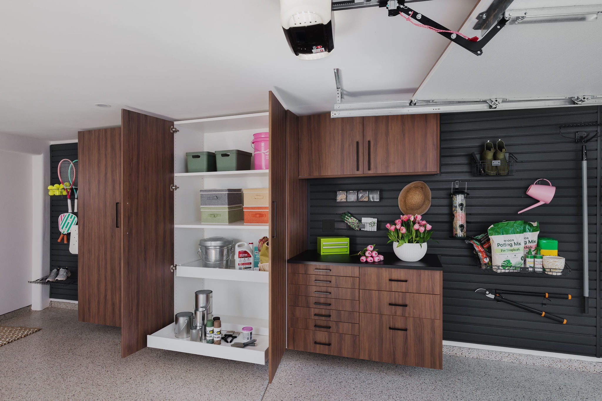 Organized garage workspace with cabinetry
